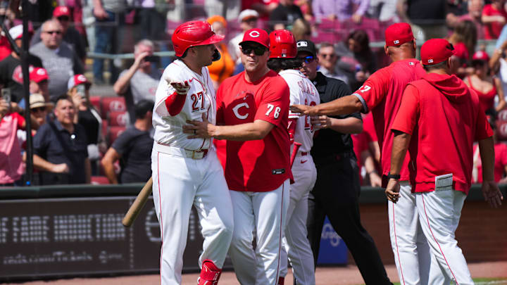 Apr 16, 2026; Cincinnati, Ohio, USA; Cincinnati Reds third baseman Sal Stewart (27) reacts to San Francisco Giants pitcher Erik Miller, not pictured, as hitting coach Chris Valaika (76) moves him towards the dugout after the final out of the ninth inning at Great American Ball Park. Mandatory Credit: Aaron Doster-Imagn Images