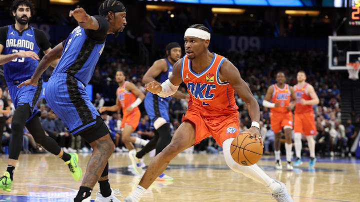 Dec 19, 2024; Orlando, Florida, USA; Oklahoma City Thunder guard Shai Gilgeous-Alexander (2) controls the ball against the Orlando Magic in the fourth quarter at Kia Center. Mandatory Credit: Nathan Ray Seebeck-Imagn Images