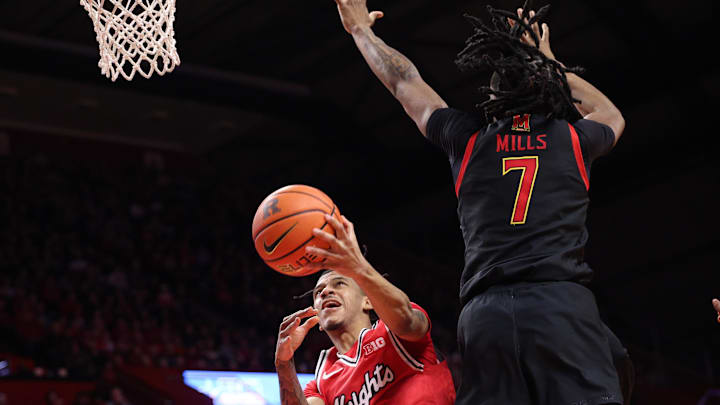 Feb 15, 2026; Piscataway, New Jersey, USA; Rutgers Scarlet Knights guard Tariq Francis (0) goes to the basket against Maryland Terrapins guard Andre Mills (7) during the second half at Jersey Mike's Arena. Mandatory Credit: Vincent Carchietta-Imagn Images Feb 15, 2026; Piscataway, New Jersey, USA; Rutgers Scarlet Knights guard Tariq Francis (0) goes to the basket against Maryland Terrapins guard Andre Mills (7) during the second half at Jersey Mike's Arena. Mandatory Credit: Vincent Carchietta-Imagn Images