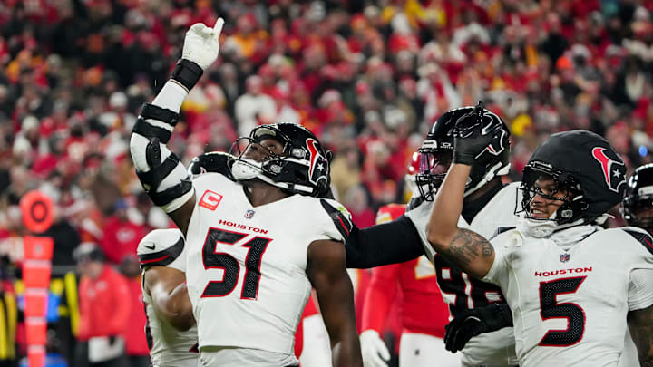 Dec 7, 2025; Kansas City, Missouri, USA; Houston Texans defensive end Will Anderson Jr. (51) and Houston Texans safety Jalen Pitre (5) celebrate after sacking Kansas City Chiefs quarterback Patrick Mahomes (15) during the first quarter at GEHA Field at Arrowhead Stadium. Mandatory Credit: Denny Medley-Imagn Images