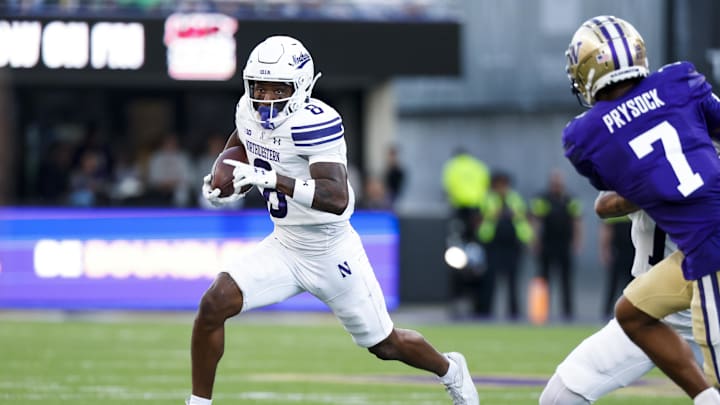 Sep 21, 2024; Seattle, Washington, USA; Northwestern Wildcats wide receiver A.J. Henning (8) rushes against the Washington Huskies during the third quarter at Alaska Airlines Field at Husky Stadium. Mandatory Credit: Joe Nicholson-Imagn Images