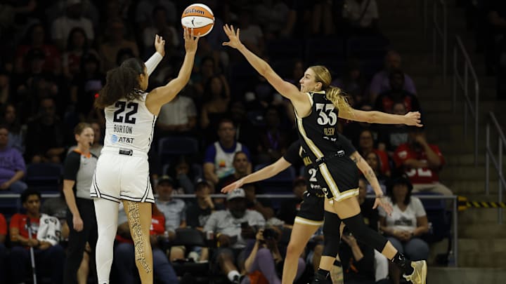 Aug 13, 2025; Washington, District of Columbia, USA; Golden State Valkyries guard Veronica Burton (22) shoots the ball over Washington Mystics guard Lucy Olsen (33) in the second half at CareFirst Arena. Mandatory Credit: Geoff Burke-Imagn Images