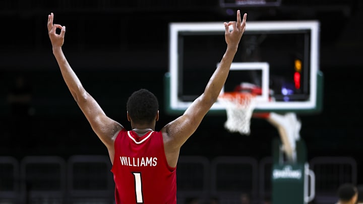 Jan 10, 2024; Coral Gables, Florida, USA; Louisville Cardinals guard Curtis Williams (1) celebrates