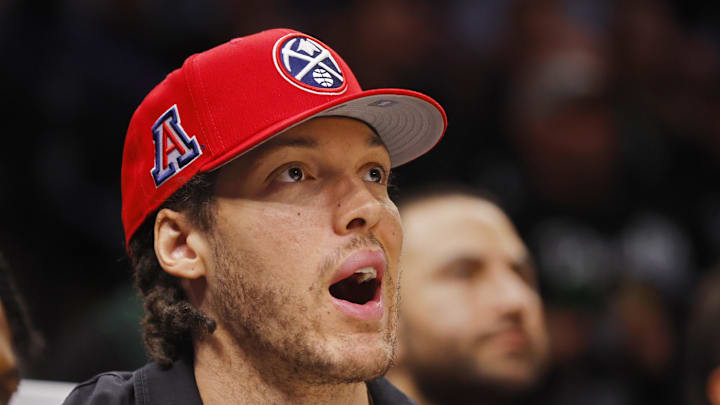 Apr 23, 2026; Minneapolis, Minnesota, USA; Denver Nuggets forward Aaron Gordon (32) watches from the bench as his team plays the Minnesota Timberwolves in the third quarter at Target Center. Mandatory Credit: Bruce Kluckhohn-Imagn Images