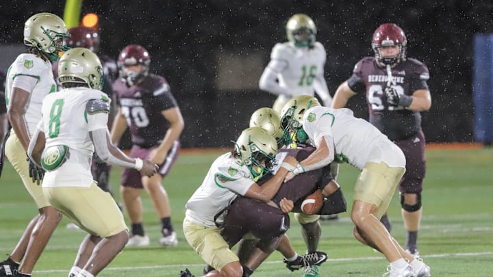 Benedictine's Bubba Frazier is swarmed by the Buford defense during Benedictine's home opener on Friday, August 22, 2025 at Memorial Stadium.