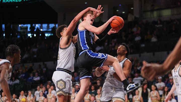 Jan 28, 2023; Atlanta, Georgia, USA; Duke Blue Devils guard Jaden Schutt (14) shoots past Georgia