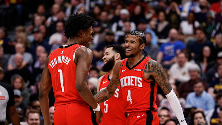 Jan 15, 2025; Denver, Colorado, USA; Houston Rockets guard Jalen Green (4) reacts with forward Amen Thompson (1) ahead of guard Fred VanVleet (5) in the second quarter against the Denver Nuggets at Ball Arena. Mandatory Credit: Isaiah J. Downing-Imagn Images