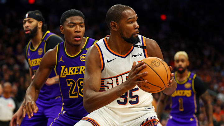 Oct 28, 2024; Phoenix, Arizona, USA; Phoenix Suns forward Kevin Durant (35) handles the ball against Los Angeles Lakers forward Rui Hachimura (28) during the second half at Footprint Center. Mandatory Credit: Mark J. Rebilas-Imagn Images