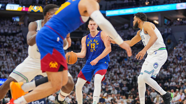 May 16, 2024; Minneapolis, Minnesota, USA; Denver Nuggets center Nikola Jokic (15) looks to pass to
