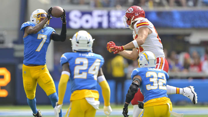 Sep 29, 2024; Inglewood, California, USA; Los Angeles Chargers cornerback Kristian Fulton (7) intercepts a pass intended for Kansas City Chiefs tight end Travis Kelce (87) in the first half at SoFi Stadium. Mandatory Credit: Jayne Kamin-Oncea-Imagn Images Sep 29, 2024; Inglewood, California, USA; Los Angeles Chargers cornerback Kristian Fulton (7) intercepts a pass intended for Kansas City Chiefs tight end Travis Kelce (87) in the first half at SoFi Stadium. Mandatory Credit: Jayne Kamin-Oncea-Imagn Images