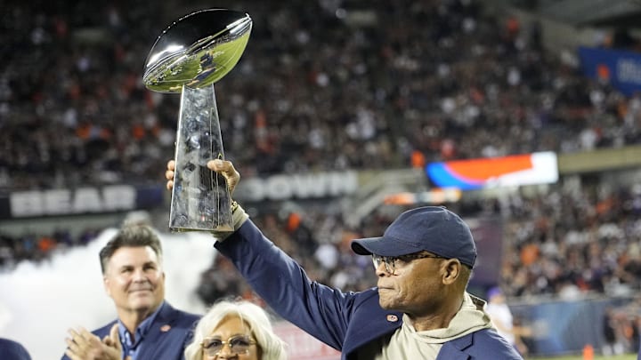 Sep 8, 2025; Chicago, Illinois, USA; Former Chicago Bear linebacker Mike Singletary holds the Super Bowl Twenty trophy during half time at Soldier Field. Mandatory Credit: David Banks-Imagn Images
