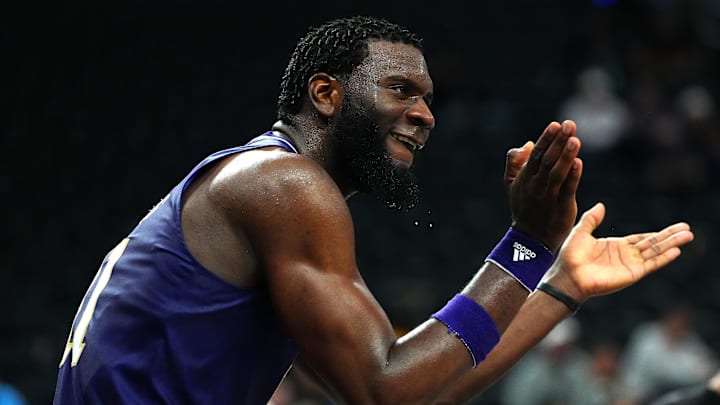 Huskies center Franck Kepnang (11) applauds a play against the Xavier Musketeers in 2023. Huskies center Franck Kepnang (11) applauds a play against the Xavier Musketeers in 2023.