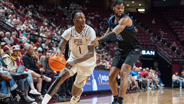 Florida State Seminoles guard Jamir Watkins (1) drives the ball to the hoop. The Florida State Seminoles defeated the Southern Methodist Mustangs 76-69 on Saturday, March 8, 2025.
