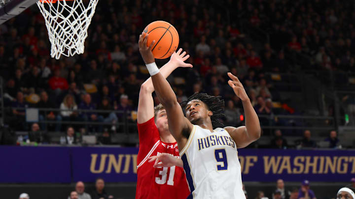 Feb 28, 2026; Seattle, Washington, USA; Washington Huskies guard Wesley Yates III (9) shoots the ball while guarded by Wisconsin Badgers forward Nolan Winter (31) during the first half at Alaska Airlines Arena at Hec Edmundson Pavilion. Mandatory Credit: Steven Bisig-Imagn Images