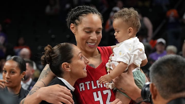 Jul 23, 2025; Phoenix, Arizona, USA; Phoenix Mercurys' Diana Taurasi talks to Atlanta Dream center Brittney Griner (42) after a game at Footprint Center. Mandatory Credit: Rick Scuteri-Imagn Images