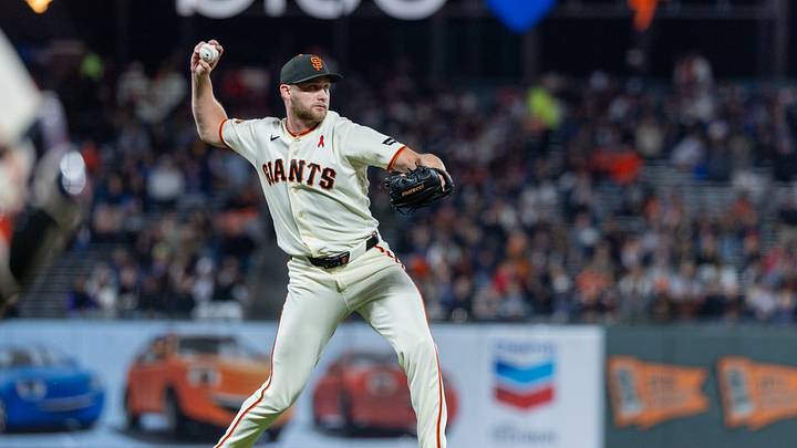Aug 10, 2026; San Francisco, California, USA; San Francisco Giants pitcher Keaton Winn (67) makes a play at first during the eighth inning against the Houston Astros at Oracle Park. Mandatory Credit: Bob Kupbens-Imagn Images