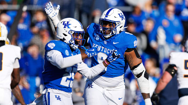 Nov 16, 2024; Lexington, Kentucky, USA; Kentucky Wildcats defensive lineman Keeshawn Silver (9) celebrates with defensive back Jordan Lovett (25) after Lovett intercepts a pass during the second quarter against the Murray State Racers at Kroger Field. Mandatory Credit: Jordan Prather-Imagn Images