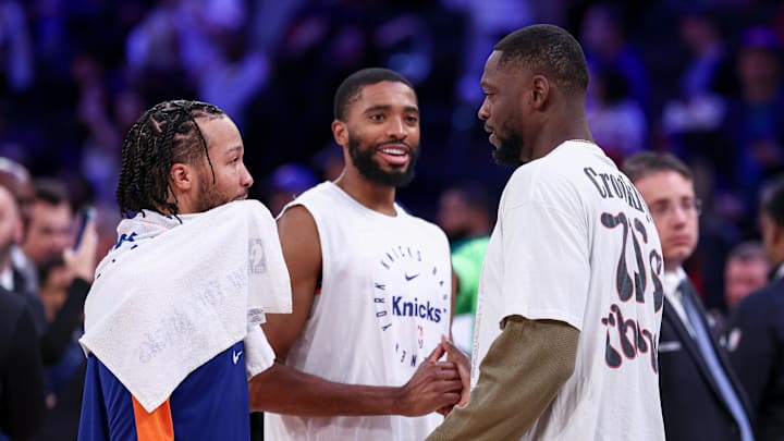 New York Knicks guard Jalen Brunson, left, and forward Mikal Bridges, center, talk with Minnesota Timberwolves forward Julius Randle, right, after the game at Madison Square Garden. Mandatory Credit: Vincent Carchietta-Imagn Images