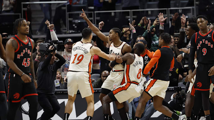 Nov 25, 2024; Detroit, Michigan, USA; Detroit Pistons guard Jaden Ivey (23) receives congratulations from teammates after he makes a buzzer-beater to win the game against the Toronto Raptors in the second half at Little Caesars Arena. Mandatory Credit: Rick Osentoski-Imagn Images Nov 25, 2024; Detroit, Michigan, USA; Detroit Pistons guard Jaden Ivey (23) receives congratulations from teammates after he makes a buzzer-beater to win the game against the Toronto Raptors in the second half at Little Caesars Arena. Mandatory Credit: Rick Osentoski-Imagn Images