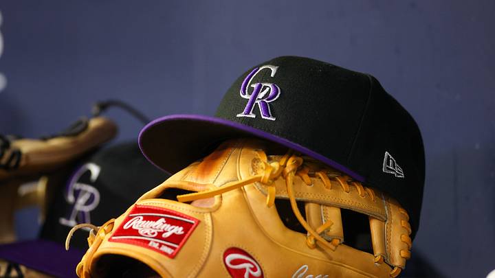 Colorado Rockies hat and glove on the bench Colorado Rockies hat and glove on the bench