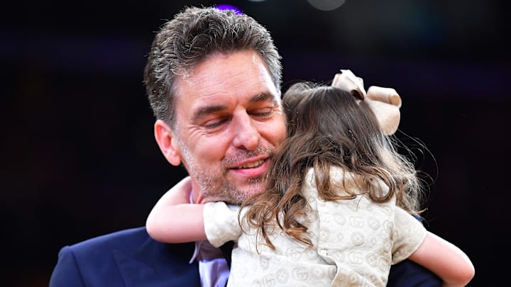 Mar 7, 2023; Los Angeles, California, USA; Los Angeles Lakers former player Pau Gasol hugs his daughter Elisabet Gianna during his jersey retirement at Crypto.com Arena. Mandatory Credit: Gary A. Vasquez-Imagn Images