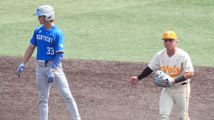 Tennessee's Ariel Antigua (2) signals he got the out against Kentucky's Kyuss Gargett (33) during an NCAA college baseball game on April 20, 2025, in Knoxville, Tenn.
