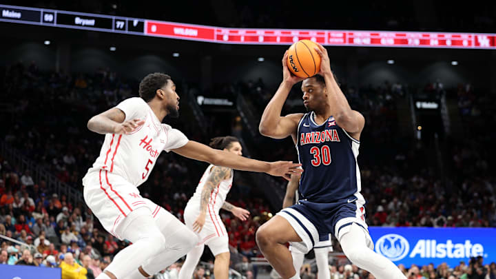 Mar 15, 2025; Kansas City, MO, USA; Arizona Wildcats forward Tobe Awaka (30) attempts to shoot the ball against Houston Cougars forward Ja'Vier Francis (5) during the second half for the Big 12 Conference Tournament Championship game at T-Mobile Center. Mandatory Credit: William Purnell-Imagn Images