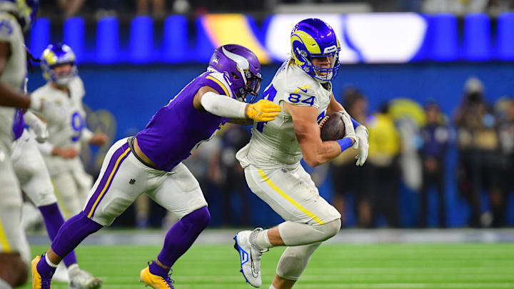 Oct 24, 2024; Inglewood, California, USA; Los Angeles Rams tight end Hunter Long (84) runs the ball  ahead of Minnesota Vikings linebacker Ivan Pace Jr. (0) during the second half at SoFi Stadium. Mandatory Credit: Gary A. Vasquez-Imagn Images