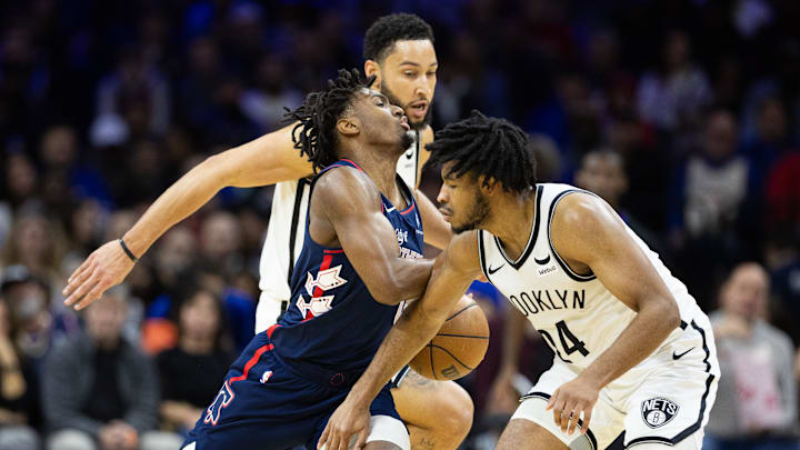 Feb 3, 2024; Philadelphia, Pennsylvania, USA; Philadelphia 76ers guard Tyrese Maxey (0) is fouled by Brooklyn Nets guard Cam Thomas (24) while dribbling up court during the second quarter at Wells Fargo Center. Mandatory Credit: Bill Streicher-Imagn Images