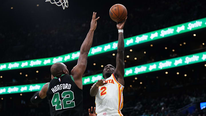 Nov 12, 2024; Boston, Massachusetts, USA; Atlanta Hawks guard Keaton Wallace (2) shoots against Boston Celtics center Al Horford (42) in the second quarter at TD Garden. Mandatory Credit: David Butler II-Imagn Images