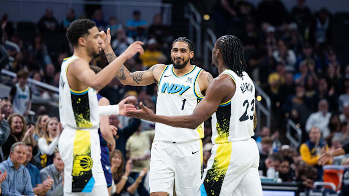 Apr 2, 2025; Indianapolis, Indiana, USA; Indiana Pacers forward Obi Toppin (1) celebrates with  guard Tyrese Haliburton (0) and forward Aaron Nesmith (23) in the second half against the Charlotte Hornets at Gainbridge Fieldhouse. Mandatory Credit: Trevor Ruszkowski-Imagn Images