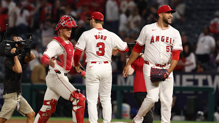Jun 28, 2024; Anaheim, California, USA;  Los Angeles Angels catcher Logan O'Hoppe (14) and designated hitter Taylor Ward (3) and relief pitcher Carlos Estevez (53) celebrate a win against the Detroit Tigers at Angel Stadium. Mandatory Credit: Kiyoshi Mio-Imagn Images