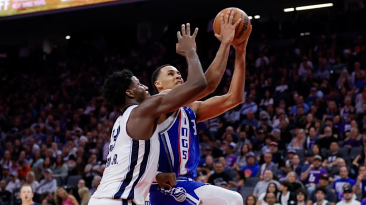 Mar 18, 2024; Sacramento, California, USA; Sacramento Kings forward Keegan Murray (13) drives to the basket against Memphis Grizzlies forward Jaren Jackson Jr. (13) during the second quarter at Golden 1 Center. Mandatory Credit: Sergio Estrada-Imagn Images