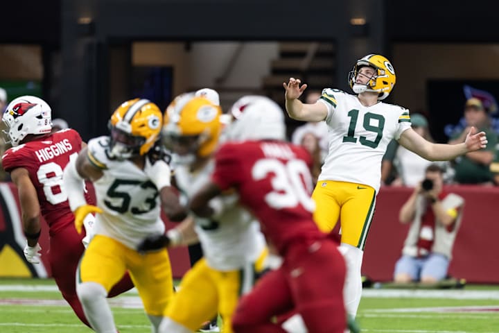 Green Bay Packers punter Daniel Whelan (19) watches his kick against the Arizona Cardinals at State Farm Stadium.