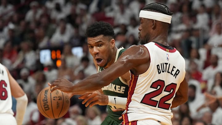Apr 24, 2023; Miami, Florida, USA; Miami Heat forward Jimmy Butler (22) defends Milwaukee Bucks forward Giannis Antetokounmpo (34) in the first quarter during game four of the 2023 NBA Playoffs at Kaseya Center. Mandatory Credit: Jim Rassol-Imagn Images