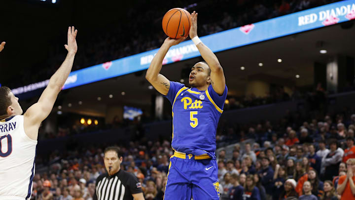 Feb 13, 2024; Charlottesville, Virginia, USA; Pittsburgh Panthers guard Ishmael Leggett (5) shoots the ball over Virginia Cavaliers guard Taine Murray (10) during the first half at John Paul Jones Arena. Mandatory Credit: Amber Searls-Imagn Images