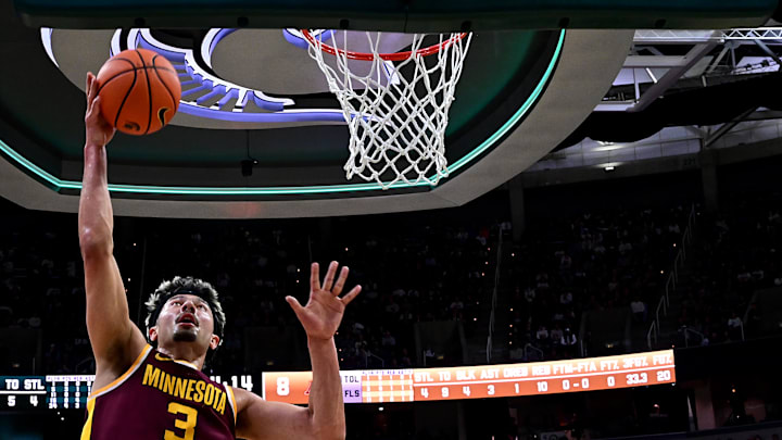 Jan 28, 2025; East Lansing, Michigan, USA;  Minnesota Golden Gophers forward Dawson Garcia (3) takes the ball to the basket against the Michigan State Spartans during the first half at Jack Breslin Student Events Center. Mandatory Credit: Dale Young-Imagn Images
