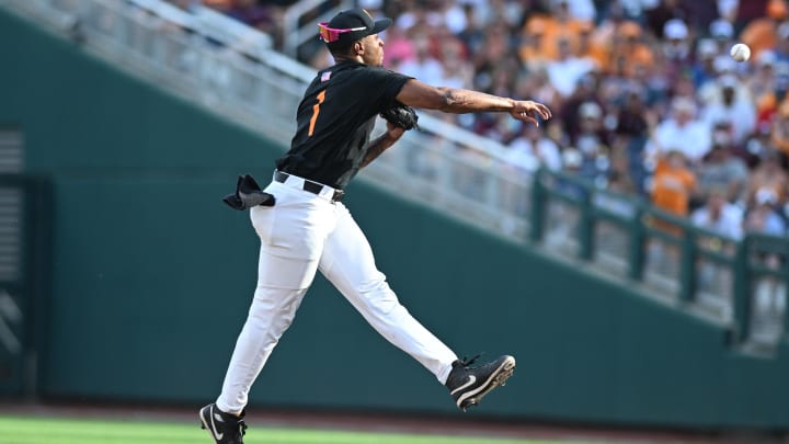 Jun 24, 2024; Omaha, NE, USA; Tennessee Volunteers second baseman Christian Moore (1) completes a double play against the Texas A&M Aggies during the third inning at Charles Schwab Field Omaha. Mandatory Credit: Steven Branscombe-USA TODAY Sports Jun 24, 2024; Omaha, NE, USA; Tennessee Volunteers second baseman Christian Moore (1) completes a double play against the Texas A&M Aggies during the third inning at Charles Schwab Field Omaha. Mandatory Credit: Steven Branscombe-USA TODAY Sports