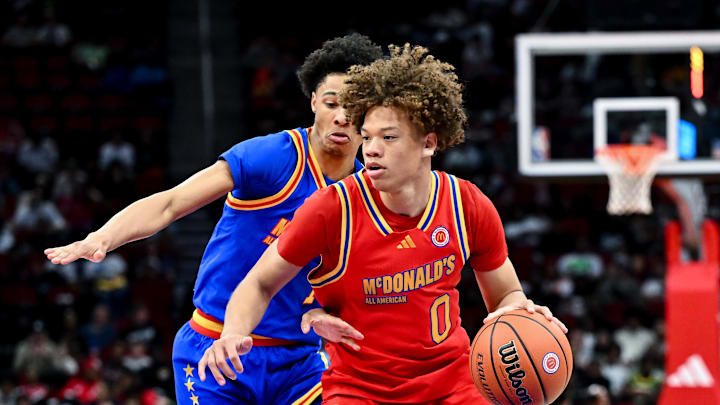 Apr 2, 2024; Houston, TX, USA; McDonald's All American West guard Trent Perry (0) controls the ball during the second half against the McDonald's All American East at Toyota Center. Mandatory Credit: Maria Lysaker-Imagn Images