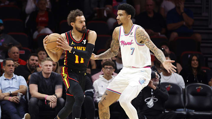 Mar 27, 2025; Miami, Florida, USA; Miami Heat center Kel'el Ware (7) defends Atlanta Hawks guard Trae Young (11) during the fist half at Kaseya Center. Mandatory Credit: Rhona Wise-Imagn Images Mar 27, 2025; Miami, Florida, USA; Miami Heat center Kel'el Ware (7) defends Atlanta Hawks guard Trae Young (11) during the fist half at Kaseya Center. Mandatory Credit: Rhona Wise-Imagn Images