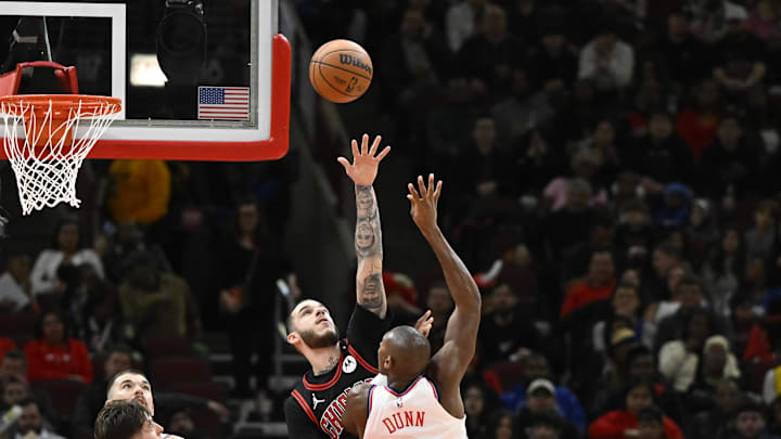 Feb 26, 2025; Chicago, Illinois, USA;  Chicago Bulls guard Lonzo Ball (2) defends against LA Clippers guard Kris Dunn (8) during the second half  at the United Center. Mandatory Credit: Matt Marton-Imagn Images