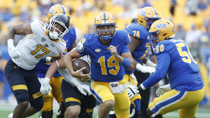 Aug 31, 2024; Pittsburgh, Pennsylvania, USA;  Pittsburgh Panthers quarterback Nate Yarnell (19) runs the ball against the Kent State Golden Flashes during the fourth quarter at Acrisure Stadium. Pittsburgh won 55-24.Mandatory Credit: Charles LeClaire-Imagn Images