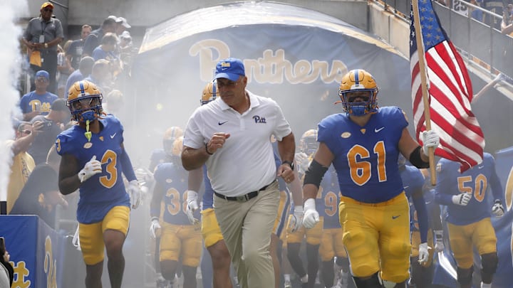 Aug 31, 2024; Pittsburgh, Pennsylvania, USA;  Pittsburgh Panthers defensive back Donovan McMillon (3) and head coach Pat Narduzzi and Pittsburgh Panthers offensive lineman Ryan Jacoby (61) lead the team onto the field against the Kent State Golden Flashes at Acrisure Stadium. Mandatory Credit: Charles LeClaire-Imagn Images