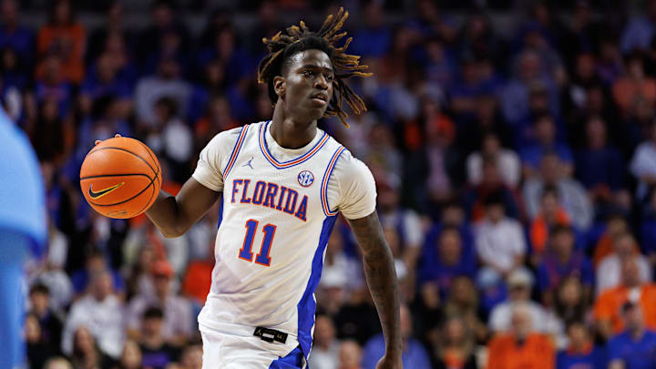 Mar 8, 2025; Gainesville, Florida, USA; Florida Gators guard Denzel Aberdeen (11) dribbles the ball against the Mississippi Rebels during the second half at Exactech Arena at the Stephen C. O'Connell Center. Mandatory Credit: Matt Pendleton-Imagn Images