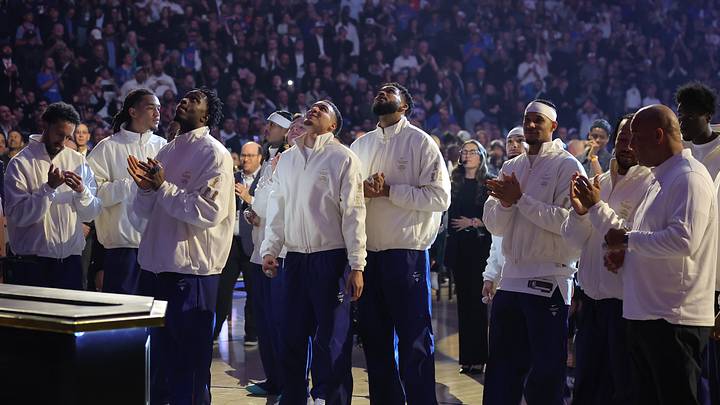 Oct 20, 2026; New York, New York, USA; New York Knicks players watch their 2025-26 championship banner ascend to the rafters during a ceremony before opening night game against the Philadelphia 76ers at Madison Square Garden. Mandatory Credit: Brad Penner-Imagn Images