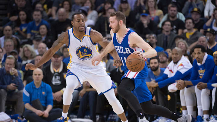 March 14, 2017; Oakland, CA, USA; Philadelphia 76ers guard Nik Stauskas (11) dribbles the basketball against Golden State Warriors forward Andre Iguodala (9) during the third quarter at Oracle Arena. The Warriors defeated the 76ers 106-104. Mandatory Credit: Kyle Terada-Imagn Images