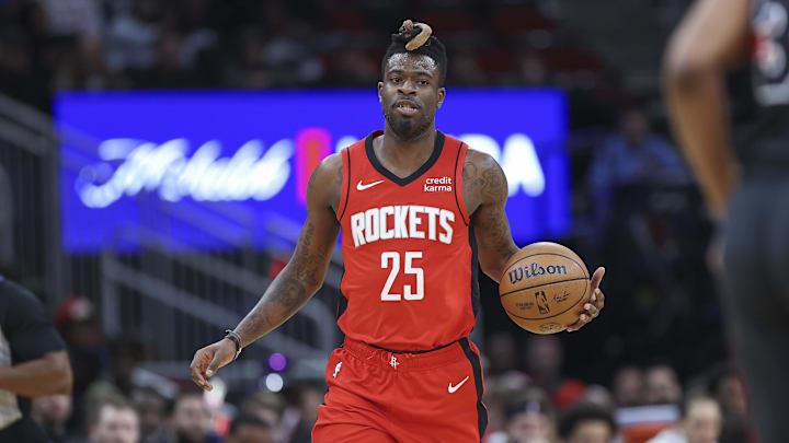 Jan 1, 2024; Houston, Texas, USA; Houston Rockets forward Reggie Bullock Jr. (25) in action during the game against the Detroit Pistons at Toyota Center. Mandatory Credit: Troy Taormina-Imagn Images