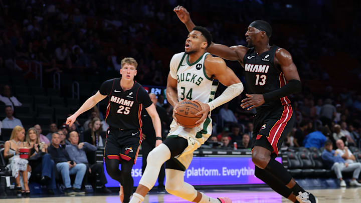 Mar 11, 2026; Miami, FL, United States; Milwaukee Bucks forward Giannis Antetokounmpo (34) drives to the basket against Miami Heat center Bam Adebayo (13) during the first quarter at loanDepot Park. Mandatory Credit: Sam Navarro-Imagn Images