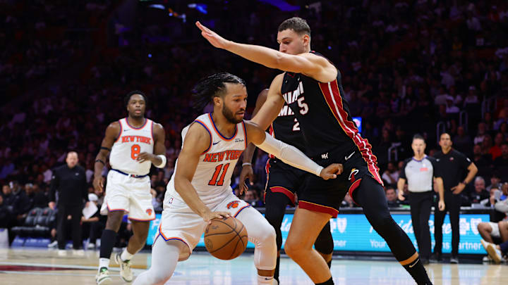 Oct 30, 2024; Miami, Florida, USA; New York Knicks guard Jalen Brunson (11) drives to the basket against Miami Heat forward Nikola Jovic (5) during the third quarter at Kaseya Center. Mandatory Credit: Sam Navarro-Imagn Images