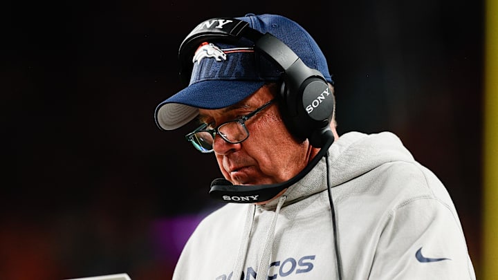Sep 29, 2025; Denver, Colorado, USA; Denver Broncos head coach Sean Payton looks at his notes during the third quarter against the Cincinnati Bengals at Empower Field at Mile High.
